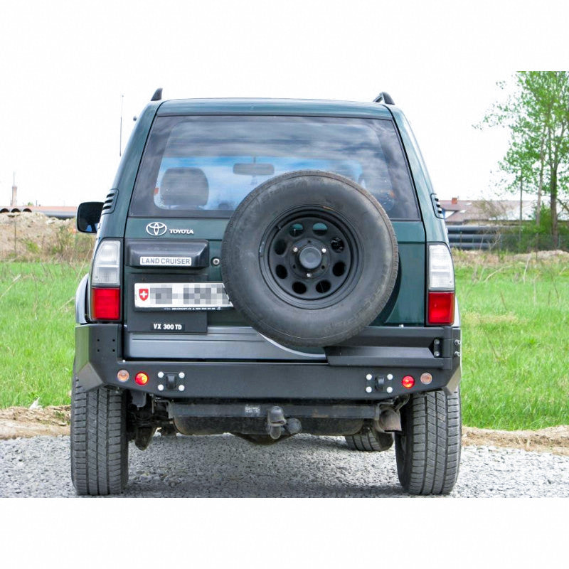 Zderzak tył Toyota LCJ95 96-02 wersja z poszerzeniami z otworami na lampy