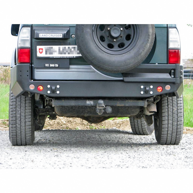 Zderzak tył Toyota LCJ95 96-02 wersja z poszerzeniami z otworami na lampy
